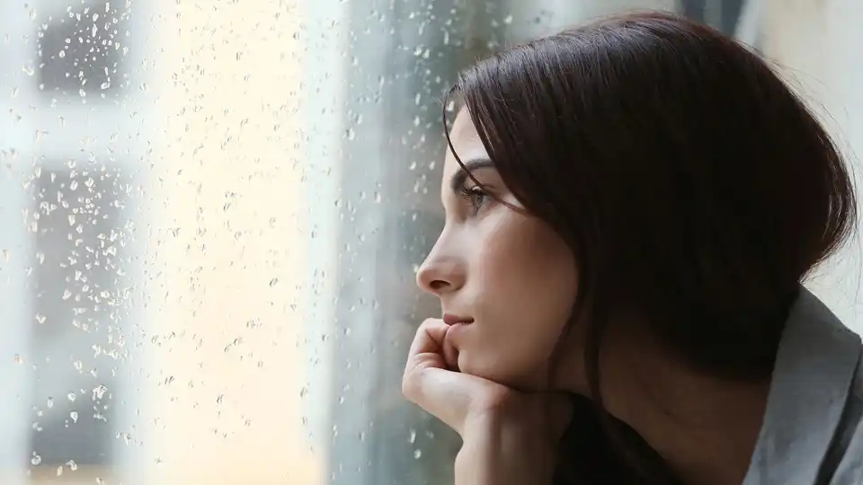 Woman inside an apartment.