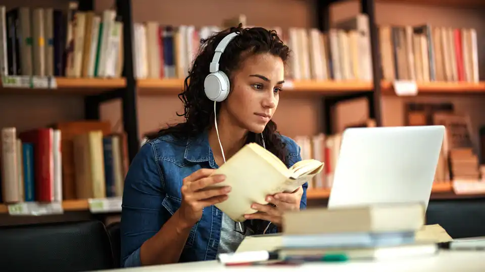 Student studying in a library.